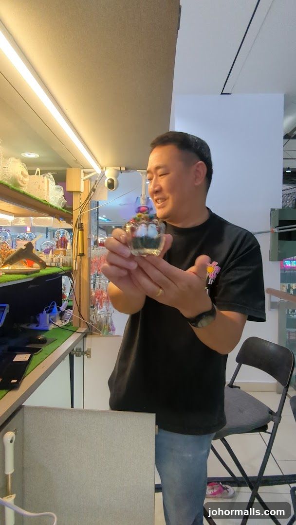 Man holding a decorative glass item