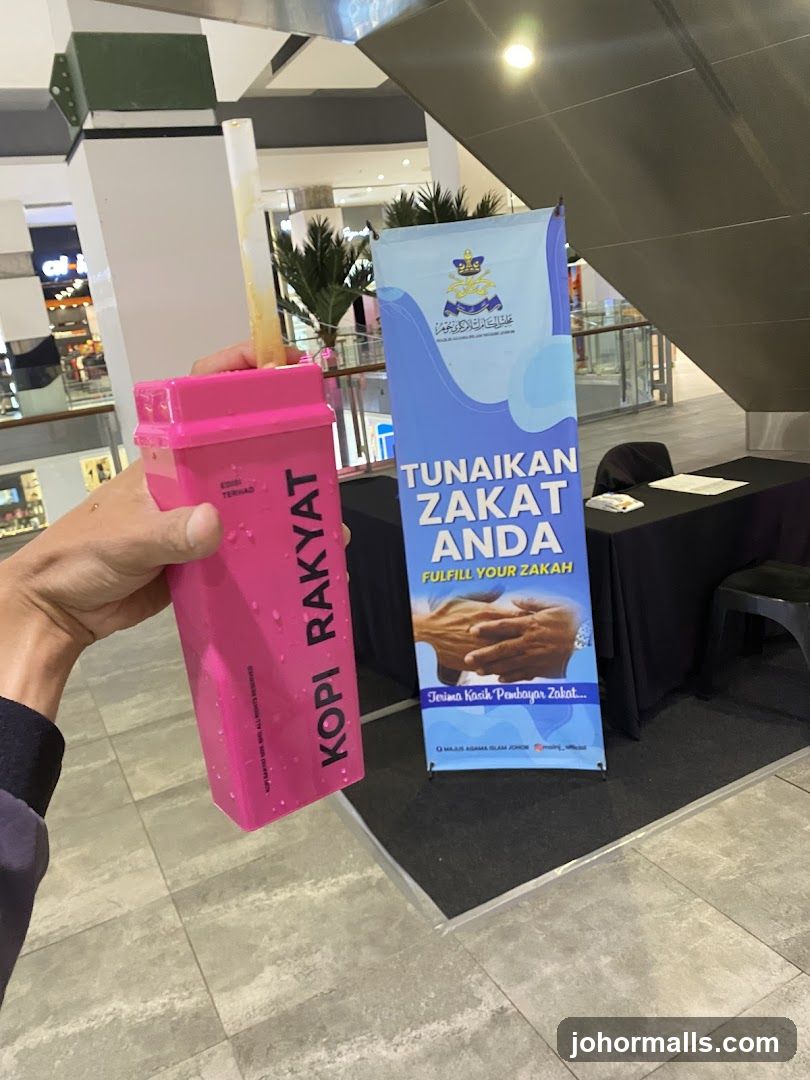 Kopi Rakyat Tumbler and Zakat Banner