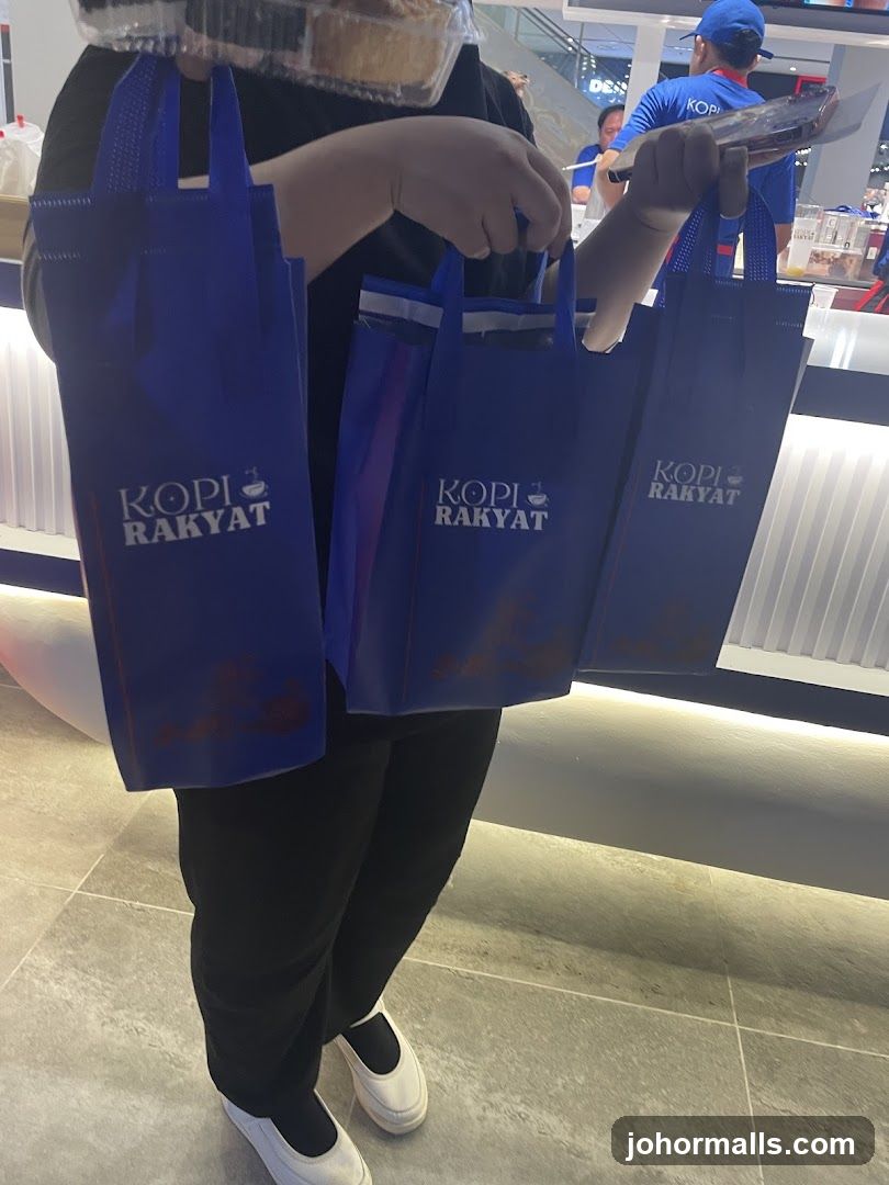 Person holding shopping bags
