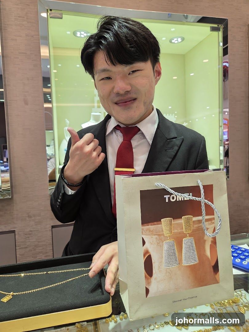 Jewelry store employee with shopping bag