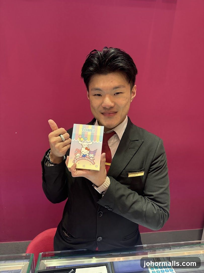 Man holding Sanrio characters notebook