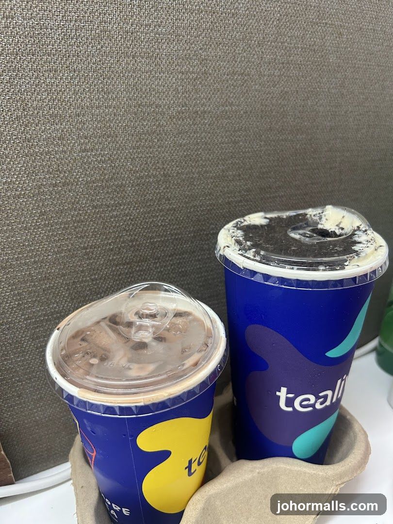 Two drinks in branded cups