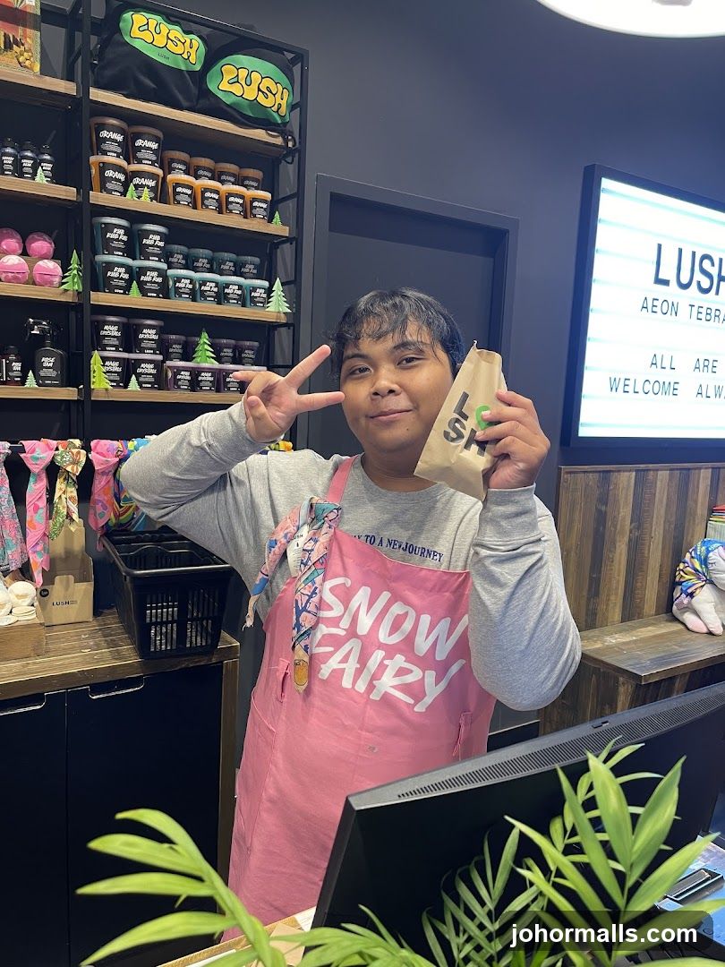 Lush Store Employee with Shopping Bag