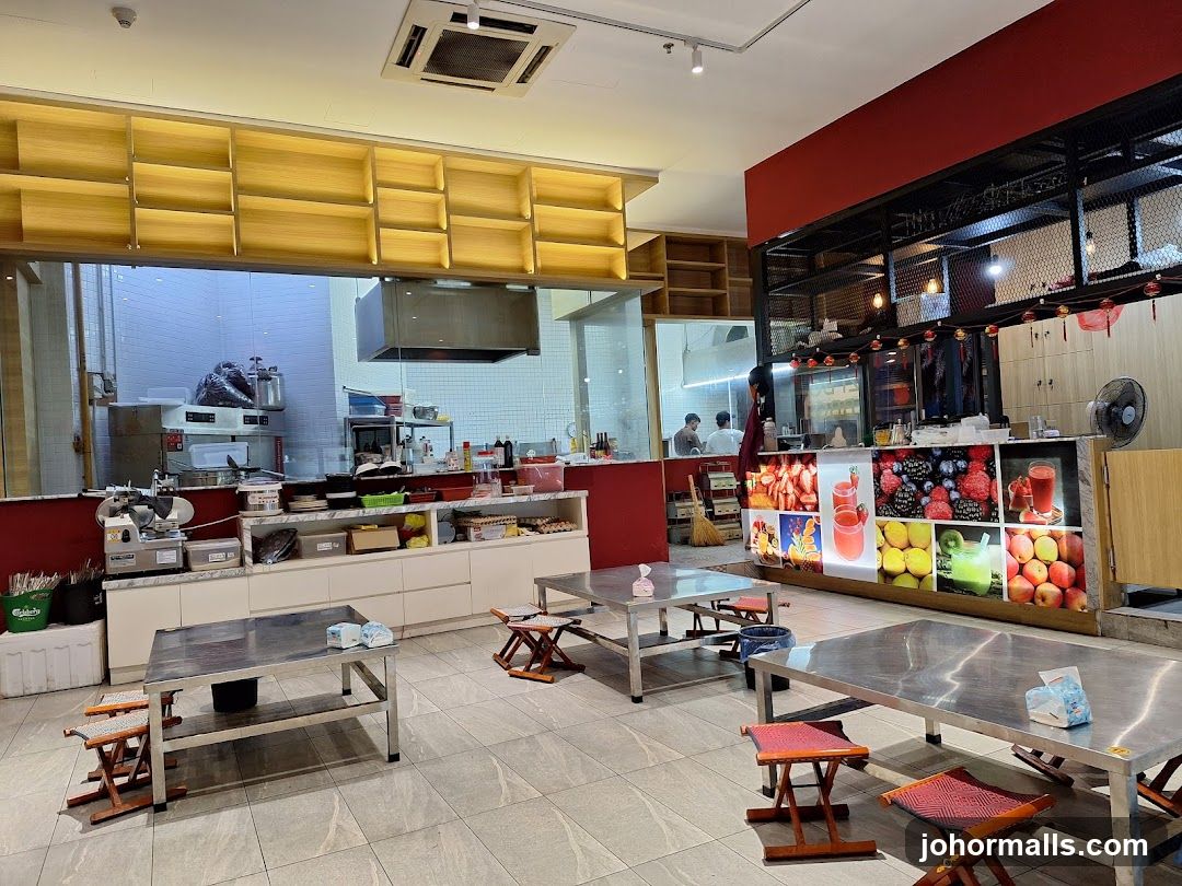 Restaurant Interior with Seating and Kitchen View