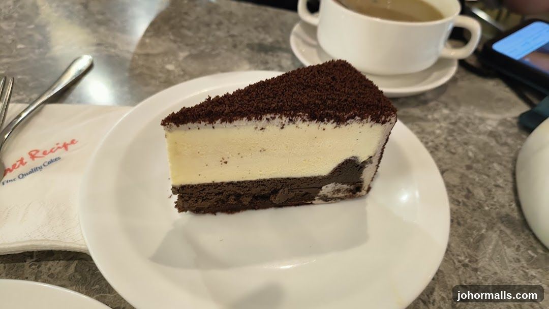 Slice of Chocolate Cheesecake with Coffee