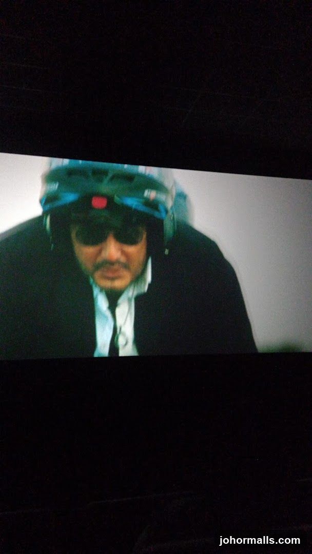 Man wearing a helmet and sunglasses