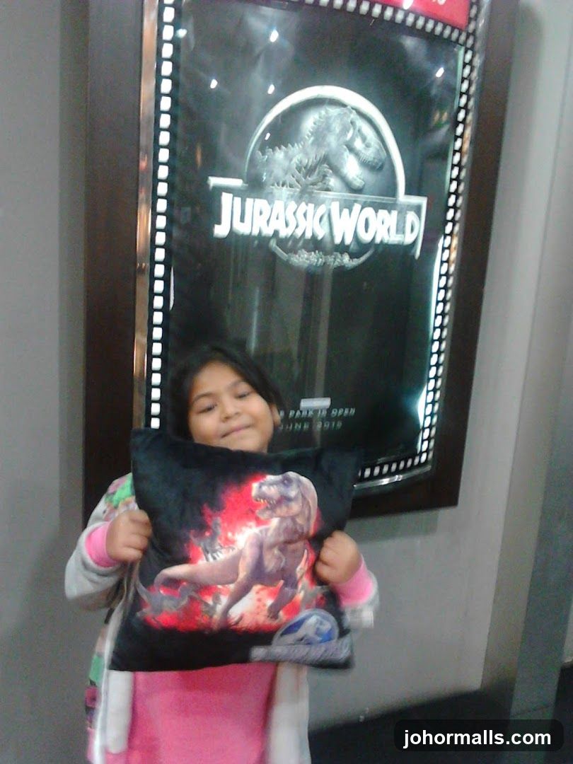 Girl with Jurassic World Pillow
