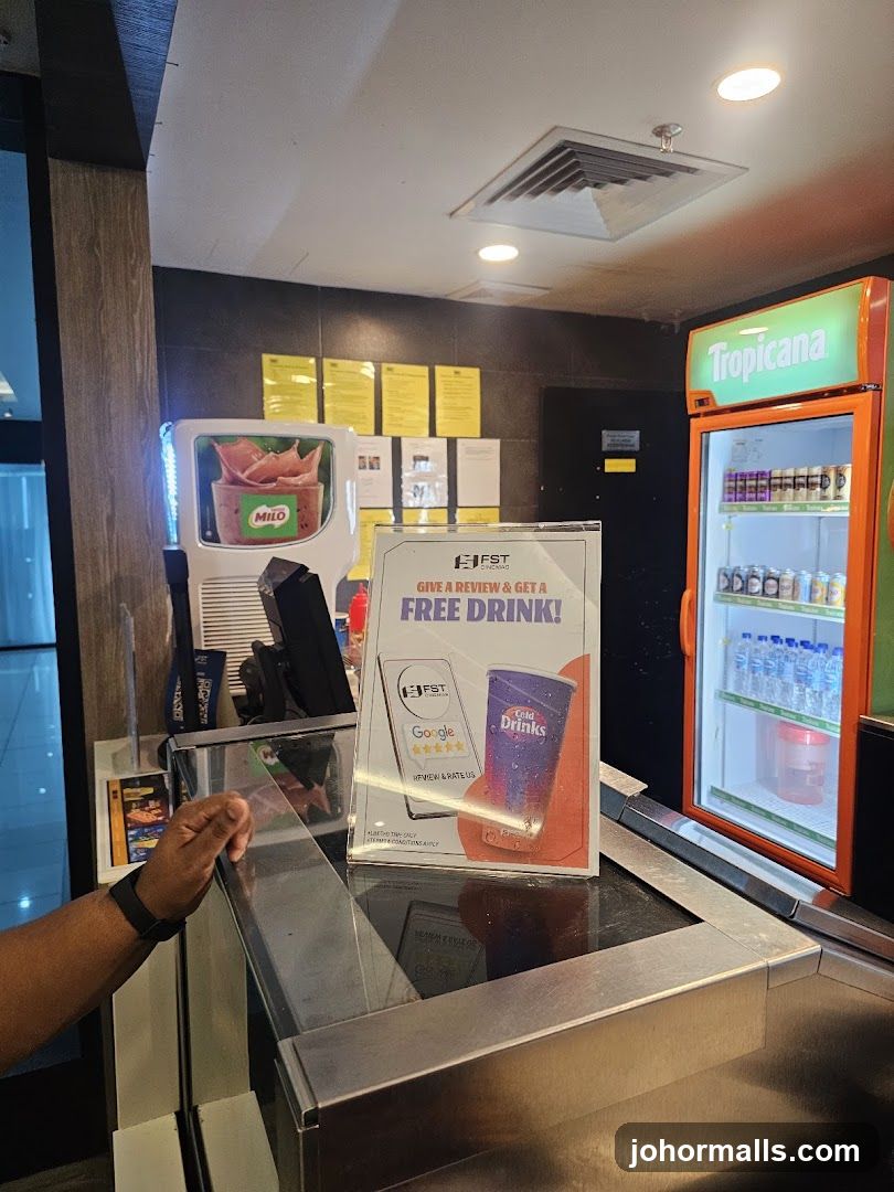 Counter with promotional sign and drinks cooler
