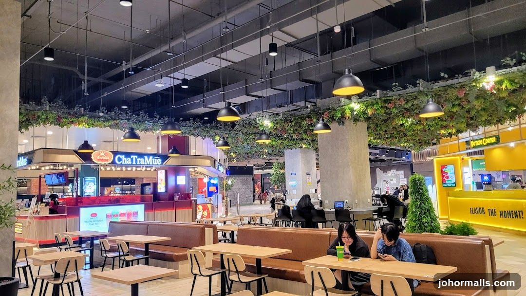 Food court with seating and various food stalls