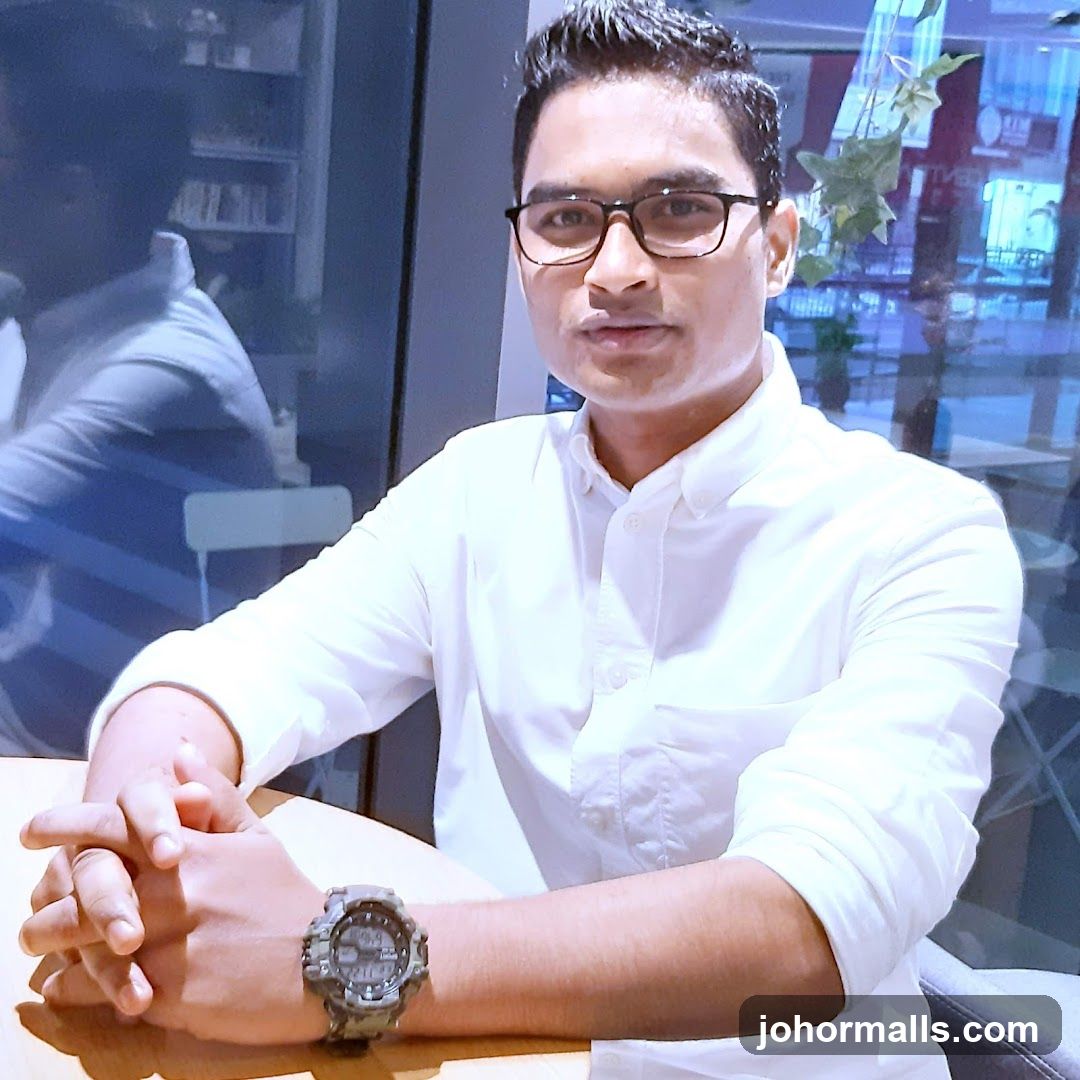 Man in a White Shirt Wearing Glasses