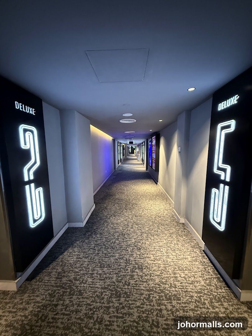 Hallway with "Deluxe" signage