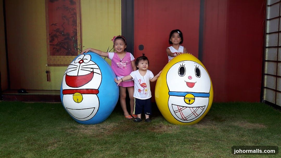 Children with Doraemon-themed decorations