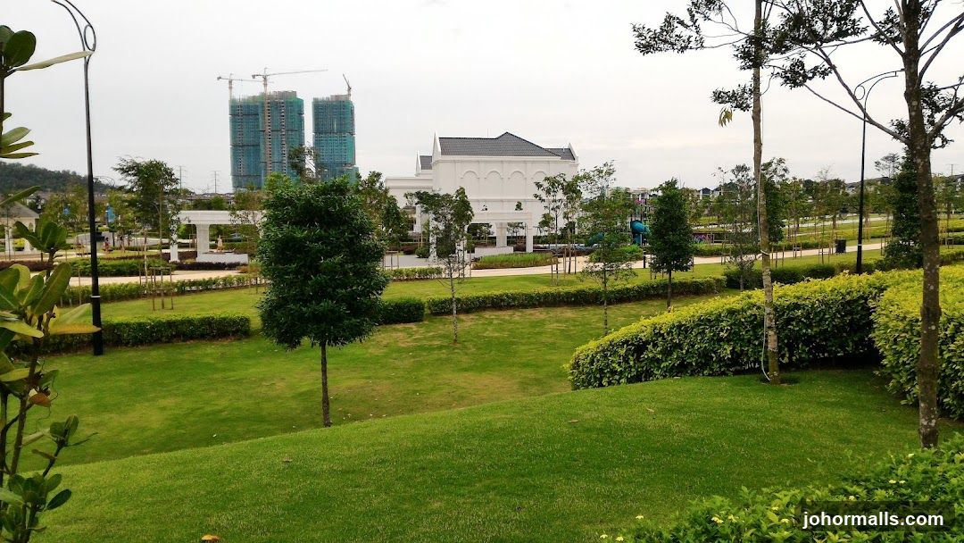 Lush Park with Construction in Background