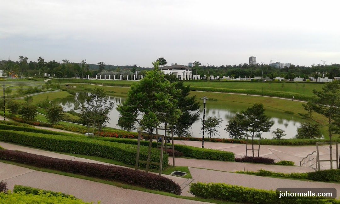 Lush park with a pond and walking paths