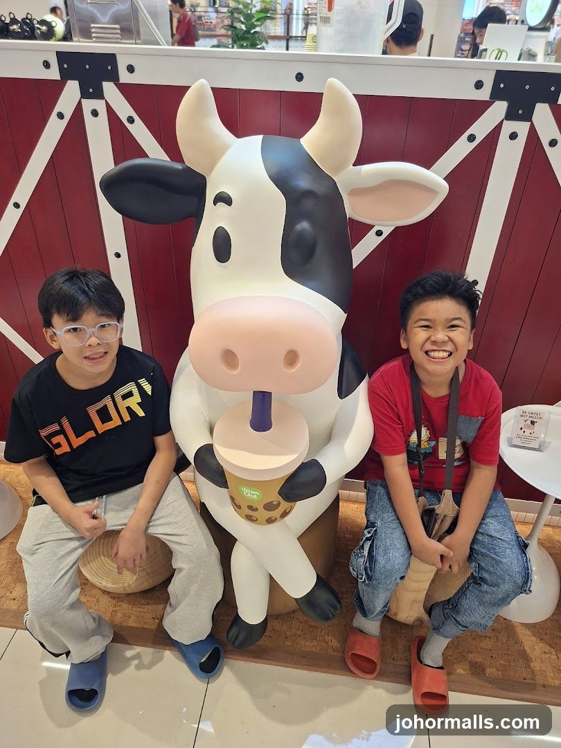 Children Posing with a Cow Mascot