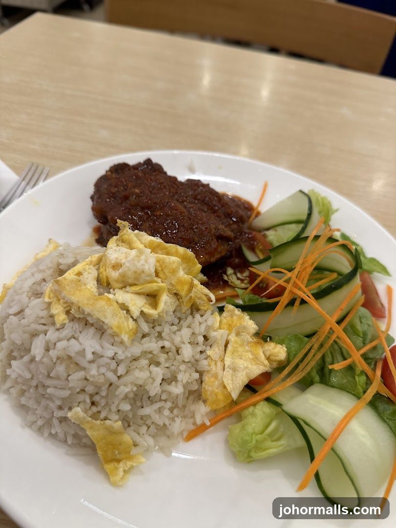 Rice dish with meat and salad