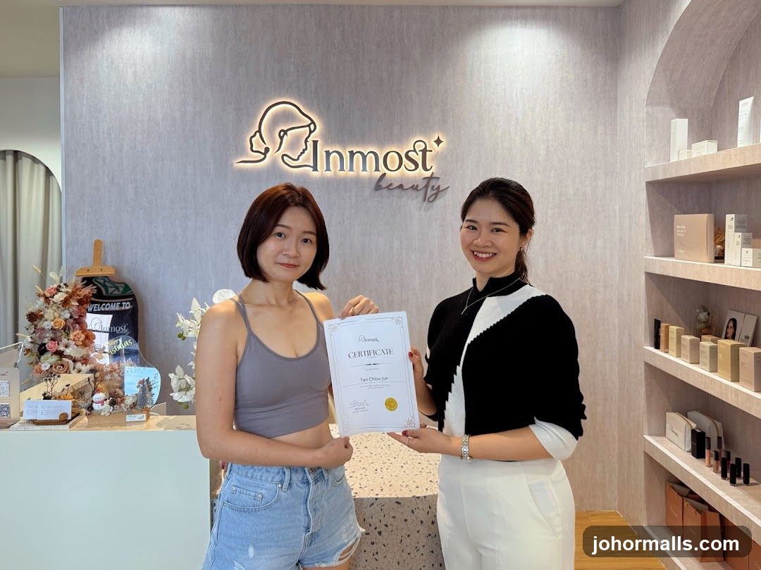 Two women holding a certificate in a beauty salon