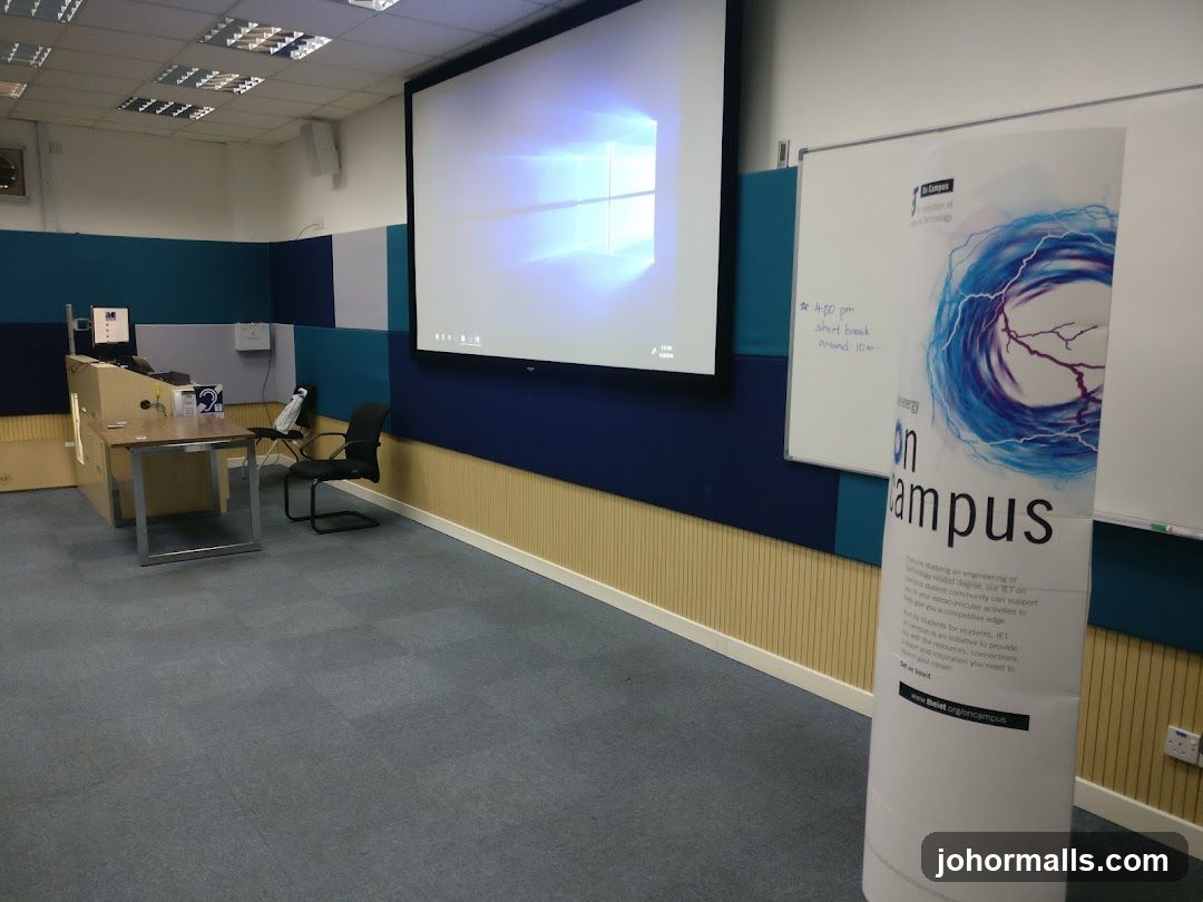 Classroom with projector screen and whiteboard