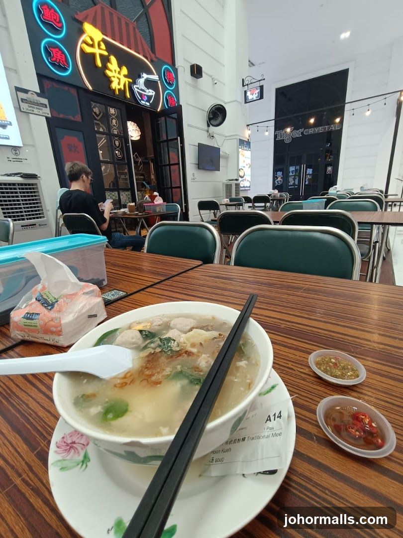 Bowl of Noodles with Condiments