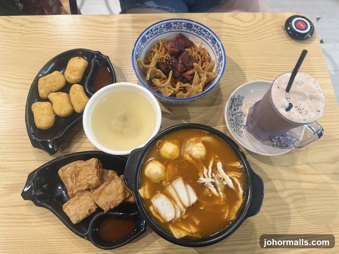 Table with various dishes and a drink