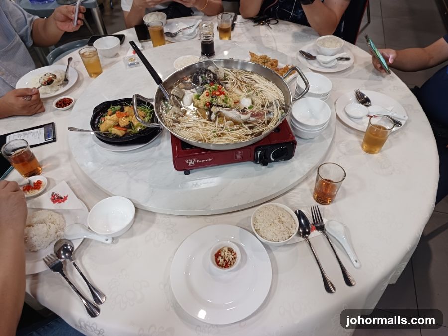 Diners Enjoying a Meal at a Round Table