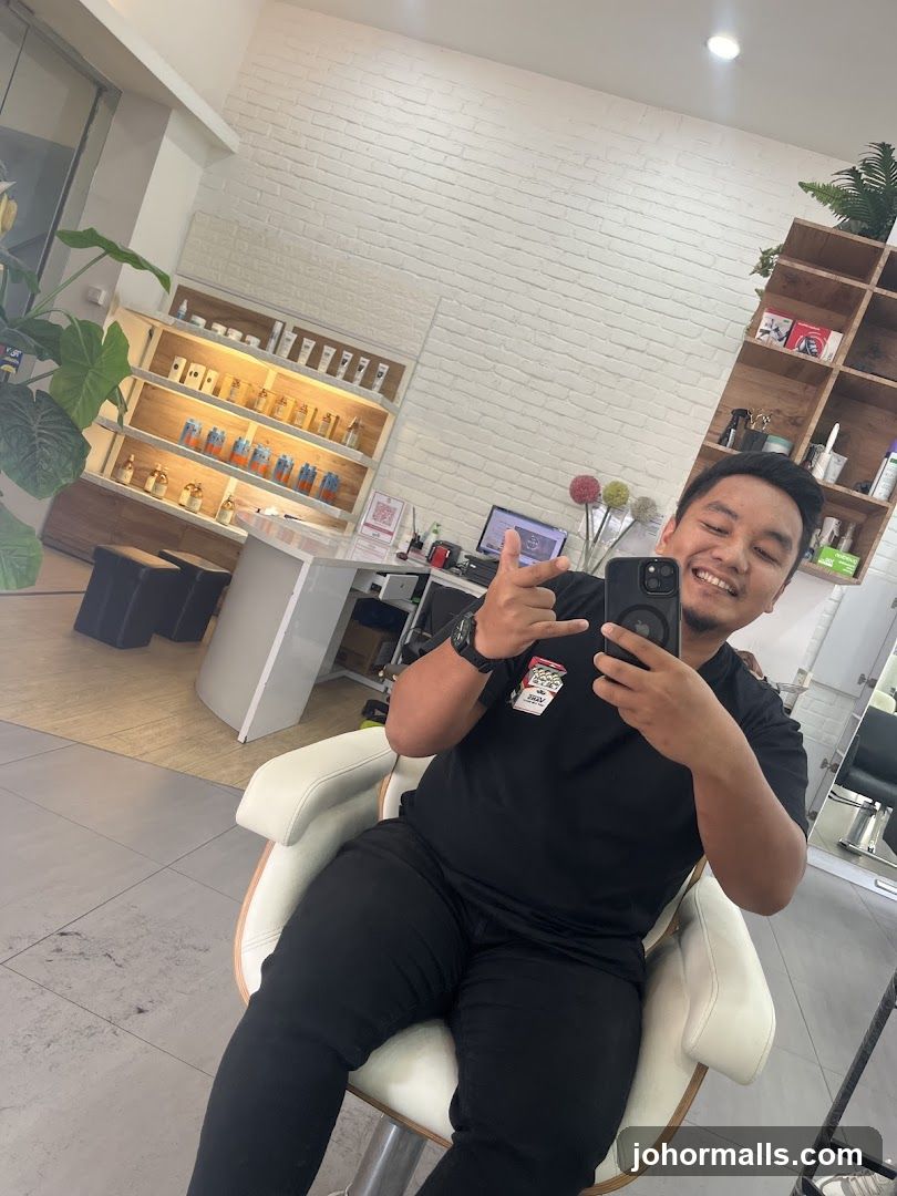 Man taking a selfie in a salon