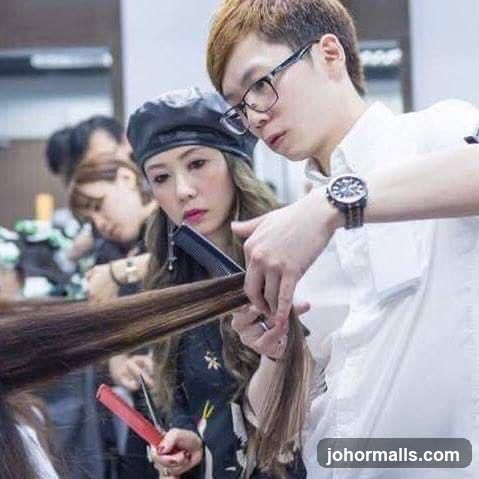 Hairdresser cutting hair