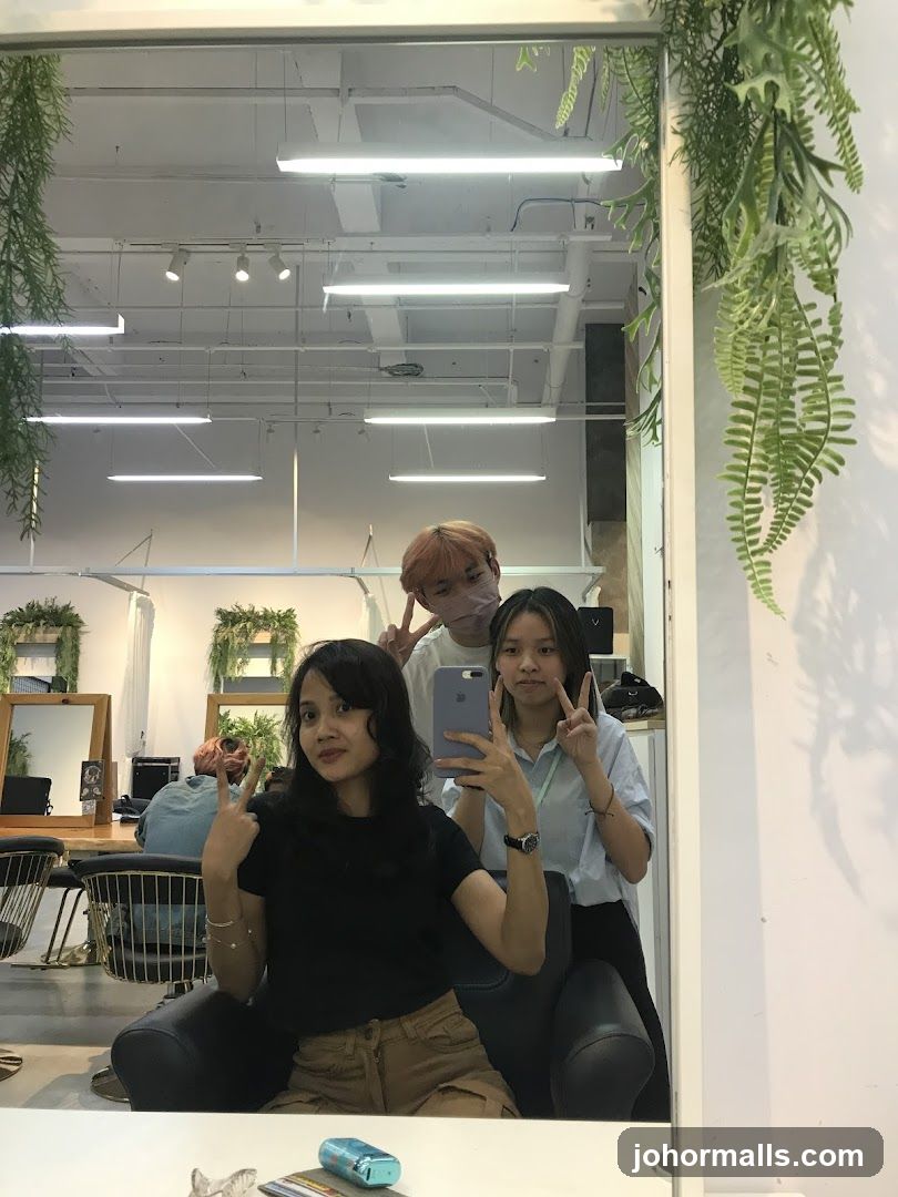 Three people taking a selfie in a salon