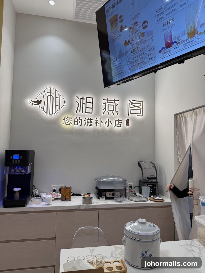 Interior of a shop with a menu board and counter