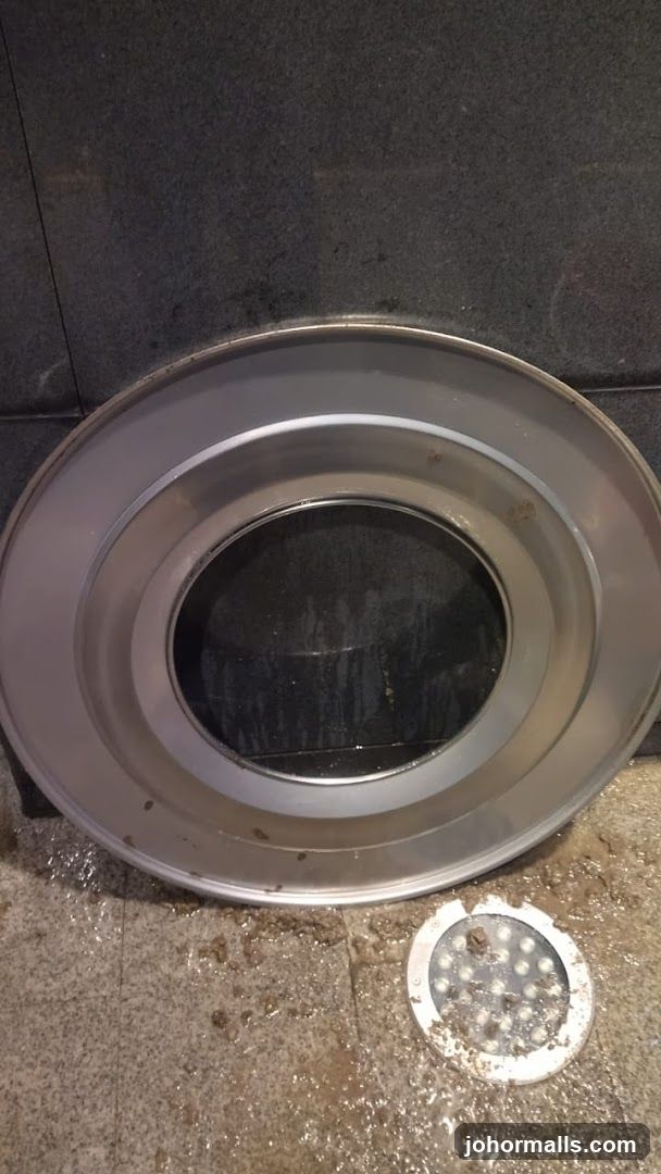 Circular Metal Object on Grungy Floor