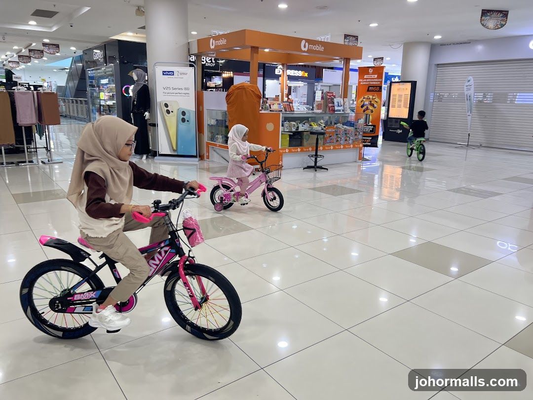 Children riding bicycles in a mall