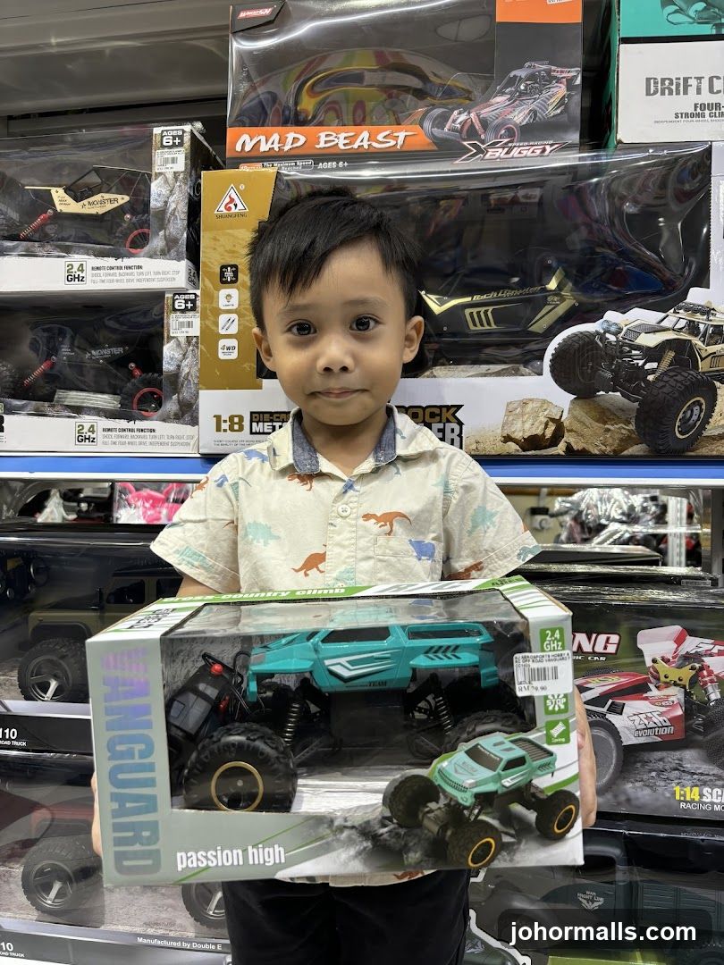 Boy Holding Toy Car