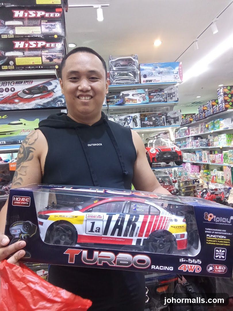 Man holding a remote control car
