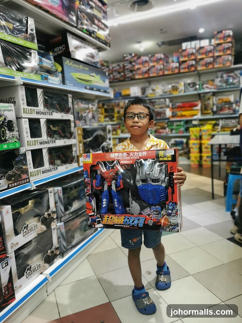 Boy Holding Toy Robot in Store
