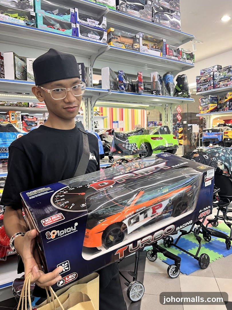 Man holding a toy car