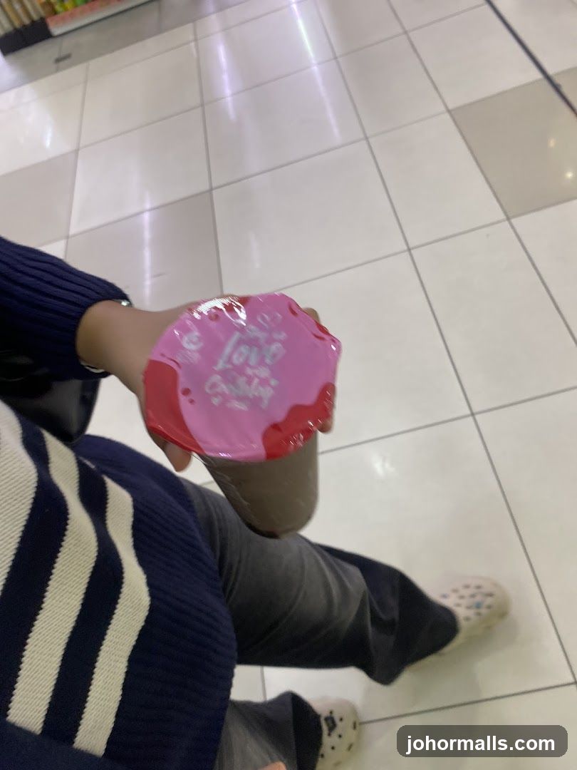Person holding a drink