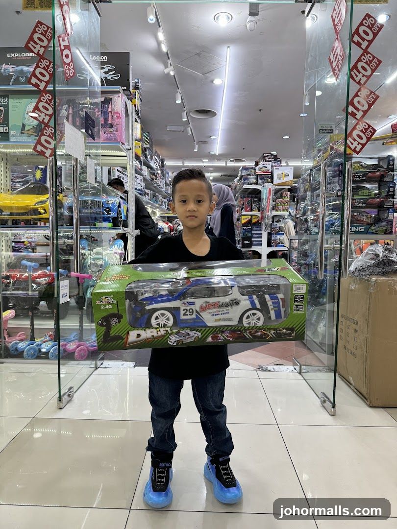 Boy Holding a Toy Car