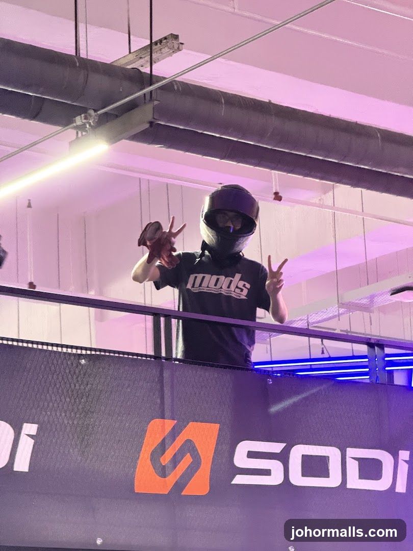 Person in helmet giving peace signs