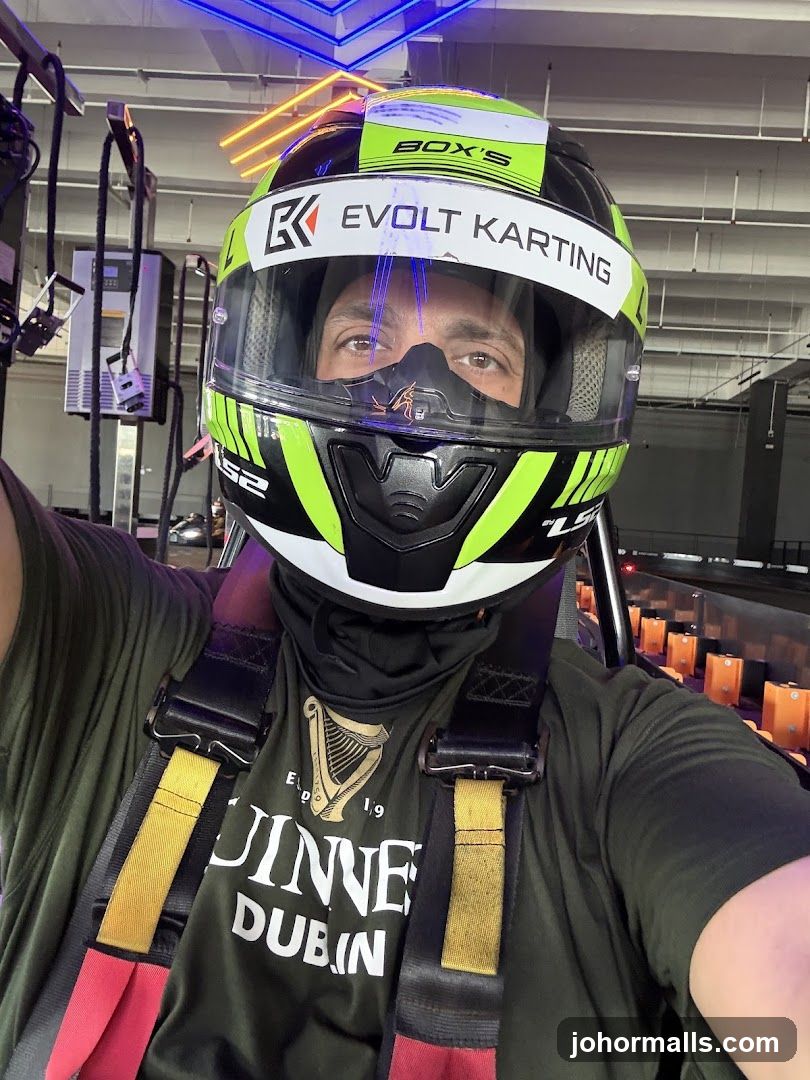 Person in Karting Helmet and Racing Suit