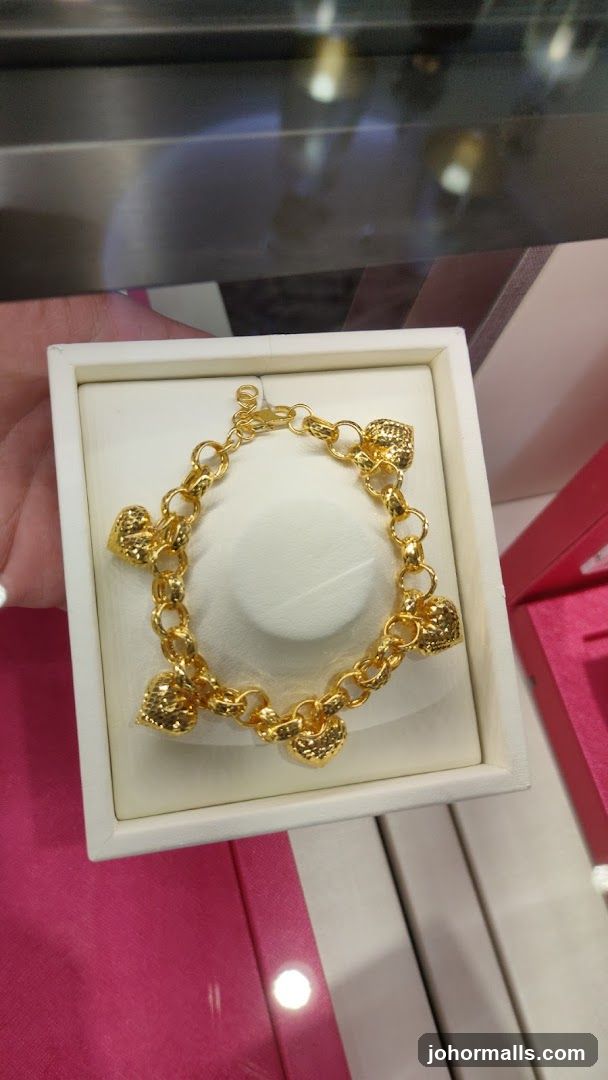 Gold Bracelet with Heart Charms