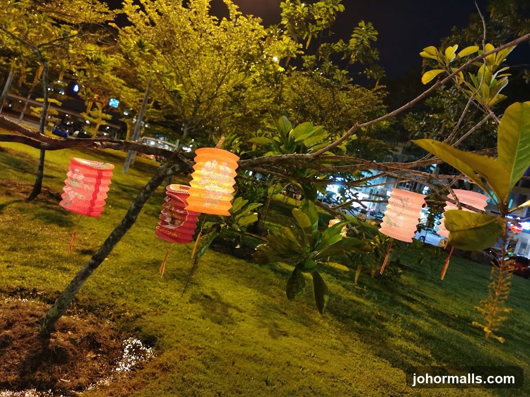 Lanterns Hanging from Tree Branches at Night