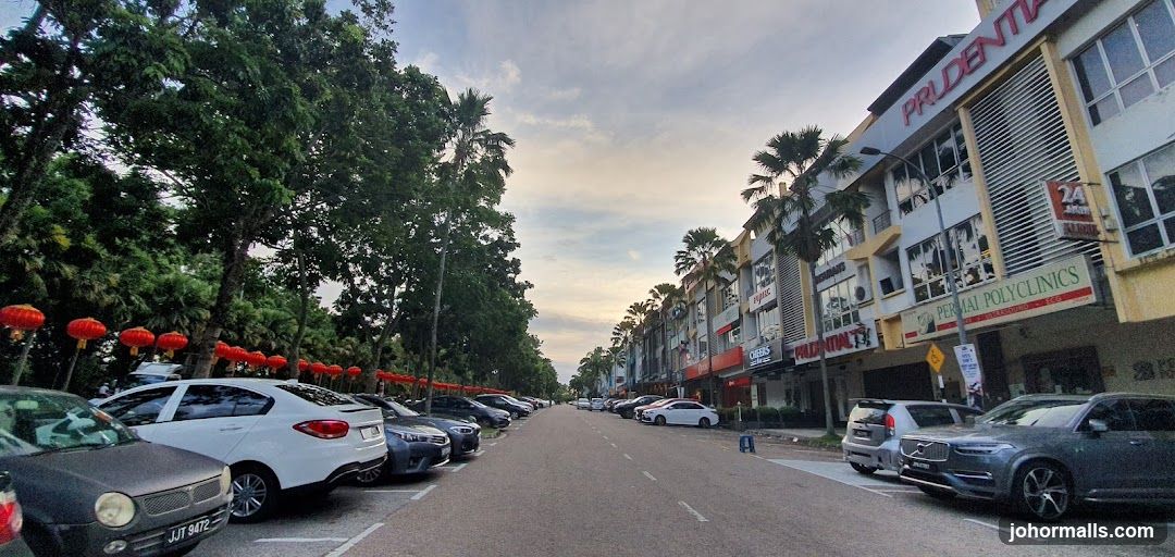 Street view with shops and parked cars