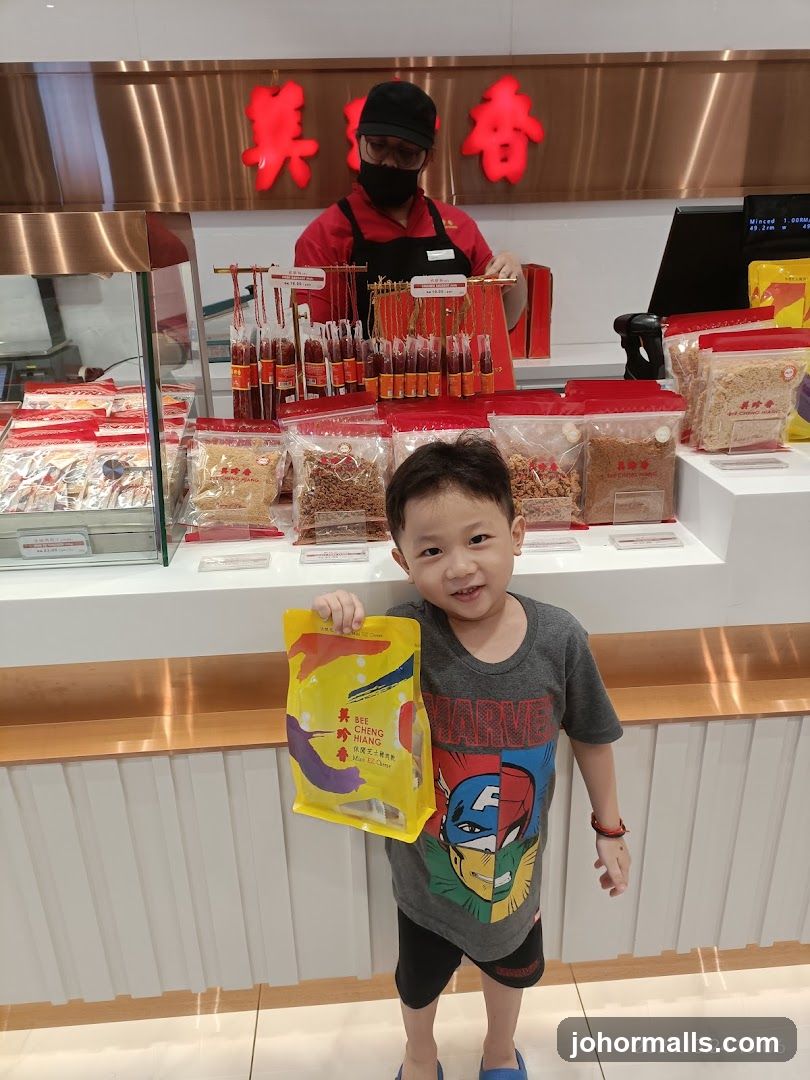Boy Holding a Bag of Snacks in a Store