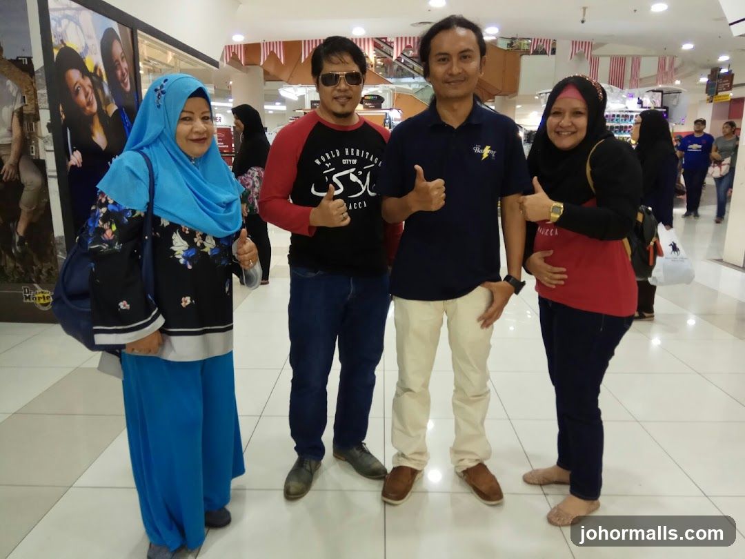 Four people posing for a photo