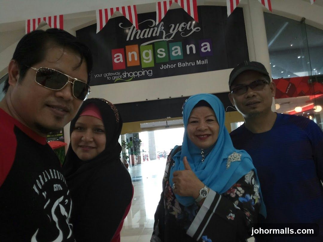 People in front of mall signage
