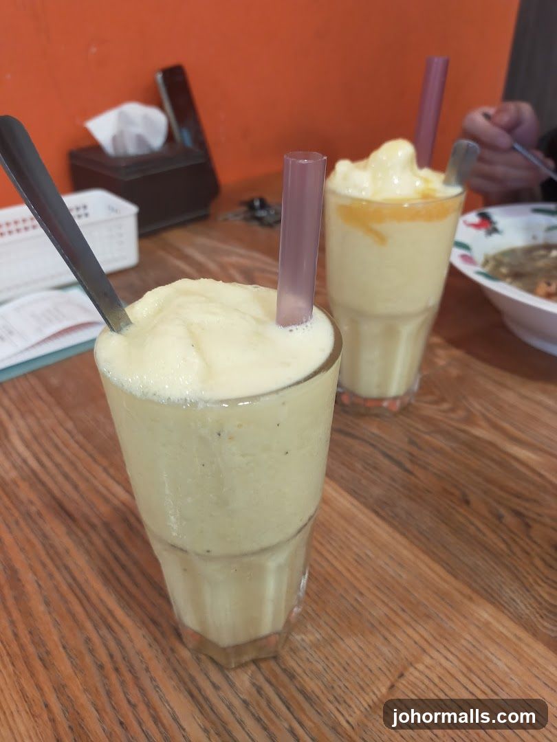 Two Smoothies on a Wooden Table