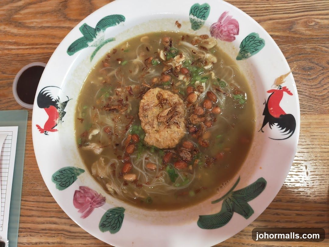Bowl of Soup with Chicken and Peanuts