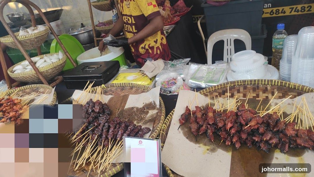 Street food stall with skewers and rice cakes