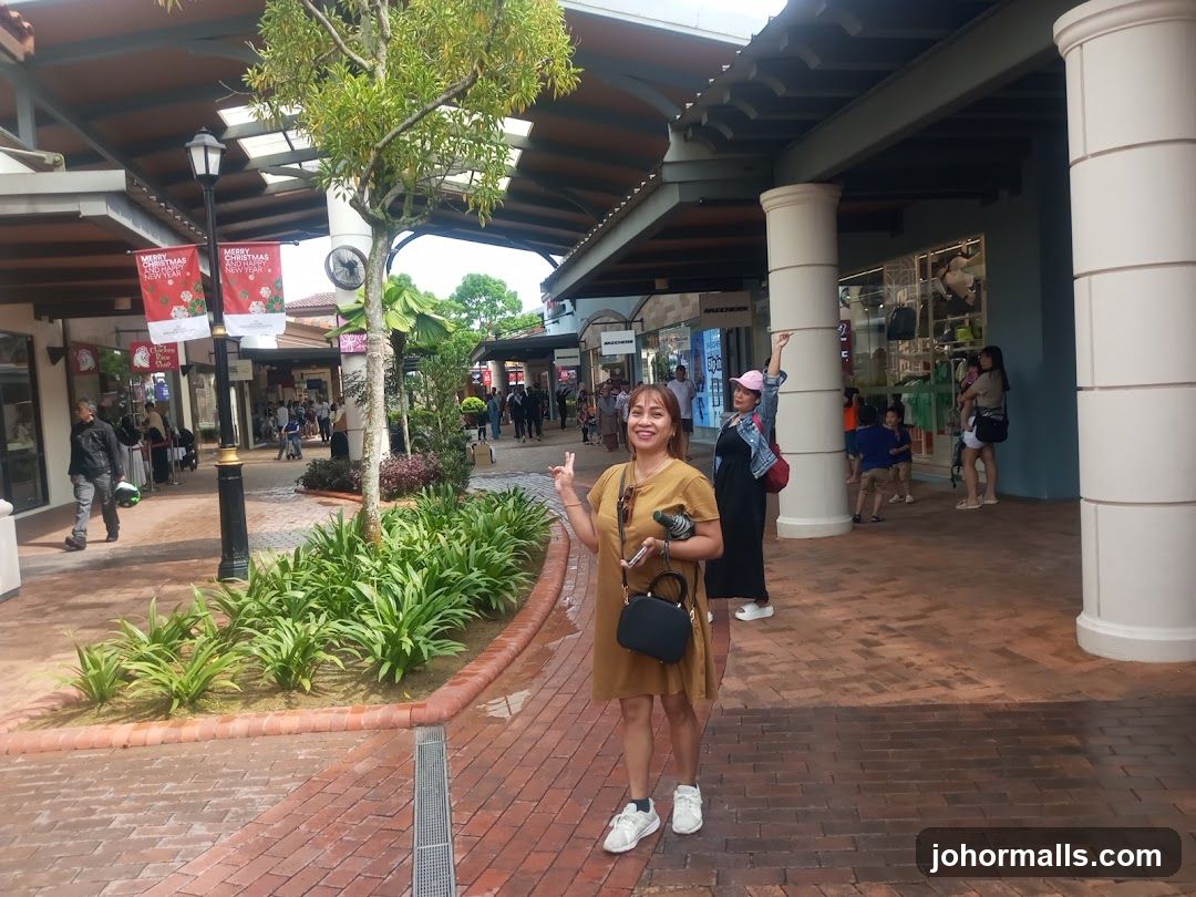 Outdoor shopping area with people