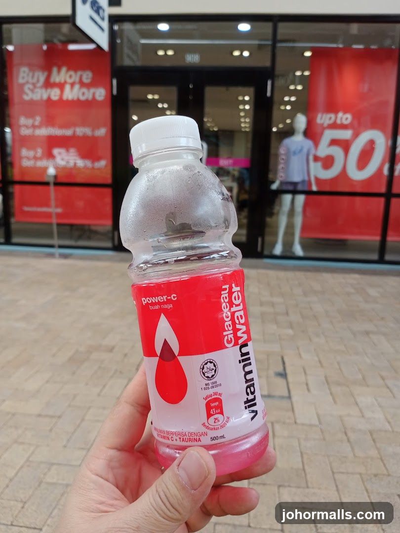Glaceau Vitaminwater Bottle with Storefront in Background